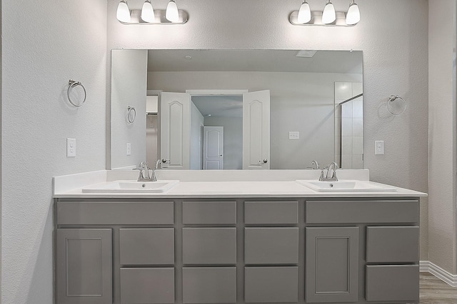 bathroom with vanity and hardwood / wood-style floors