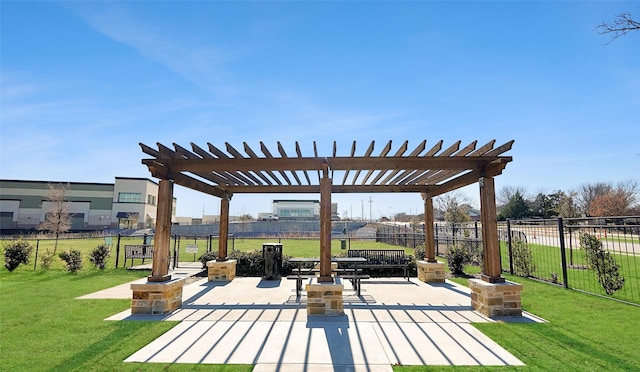 view of community featuring a lawn, a patio area, and a pergola