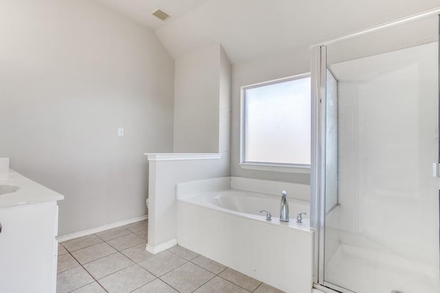 full bathroom featuring vanity, vaulted ceiling, plus walk in shower, tile patterned flooring, and toilet