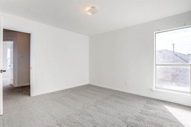 spare room featuring carpet flooring