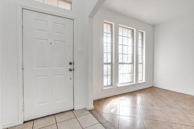 entrance foyer featuring a healthy amount of sunlight and light tile patterned flooring