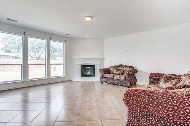 sitting room featuring plenty of natural light and light tile patterned floors