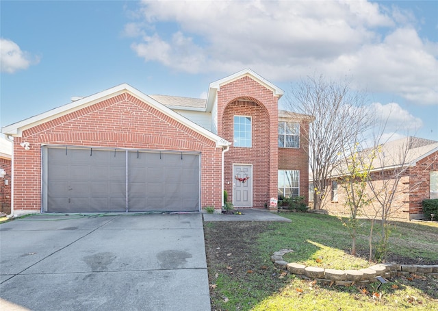 view of front property featuring a front yard and a garage