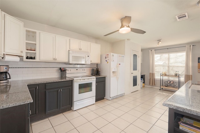 kitchen featuring light tile patterned floors, white appliances, ceiling fan, white cabinetry, and decorative backsplash