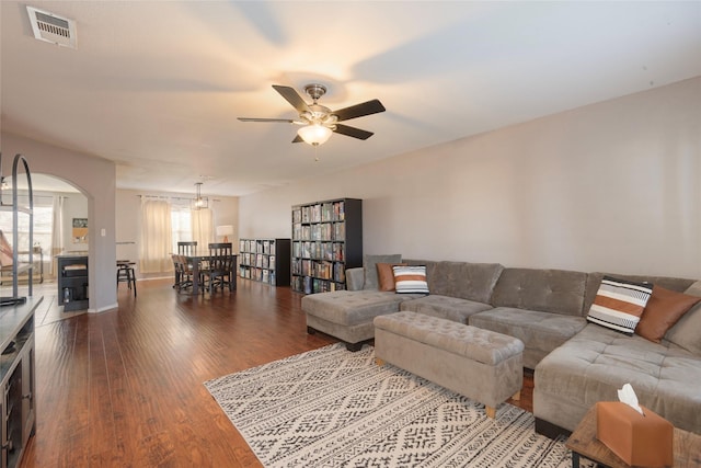 living room with hardwood / wood-style floors and ceiling fan