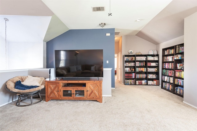 living room featuring vaulted ceiling and carpet