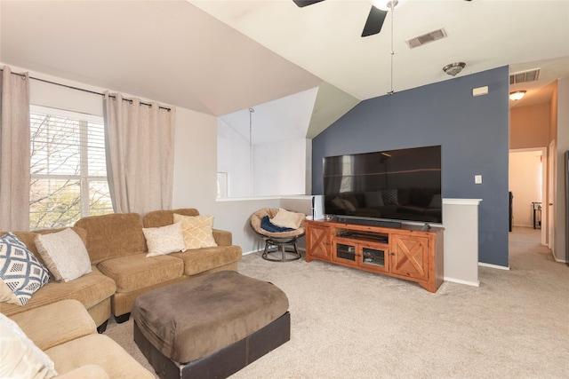 living room with ceiling fan, light colored carpet, and vaulted ceiling