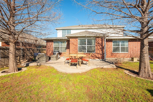 rear view of property featuring a patio area and a lawn