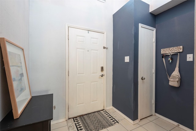 entrance foyer with light tile patterned floors