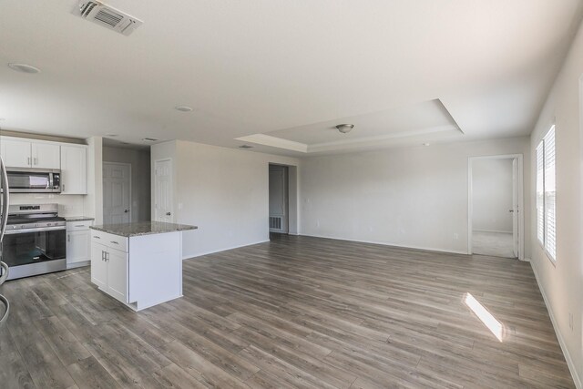 16032 Crews Ave, Haslet, TX 76052 - kitchen featuring stainless steel appliances, a raised ceiling, and open floor plan