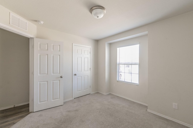 unfurnished bedroom with carpet floors and a closet