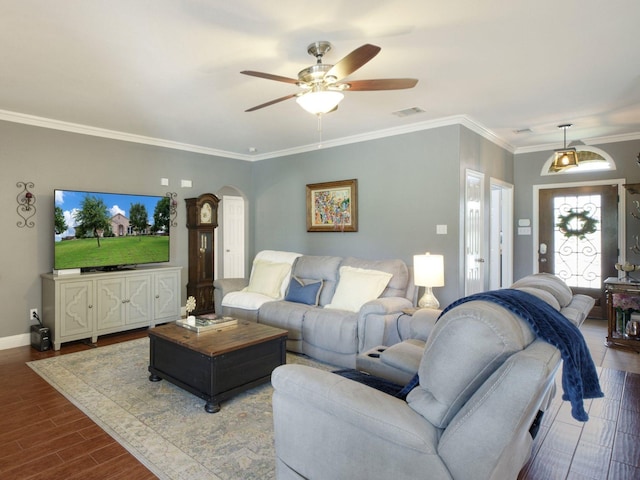 living room featuring ceiling fan and crown molding