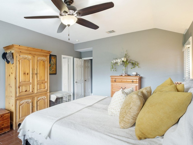 bedroom featuring ceiling fan and lofted ceiling