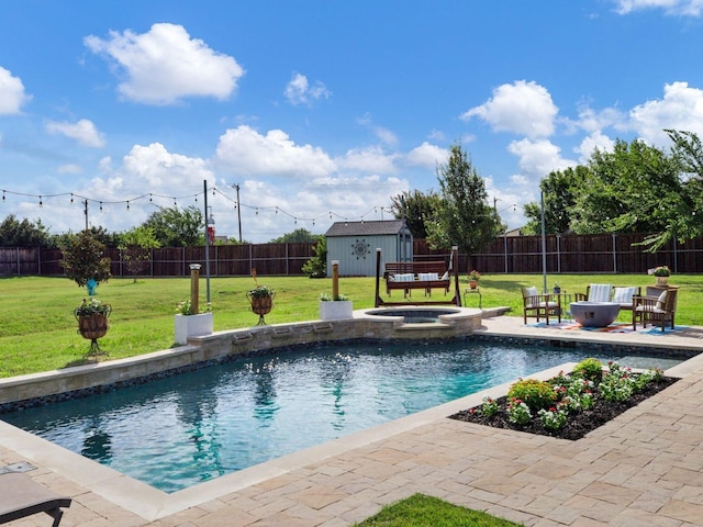 view of swimming pool featuring a lawn and an in ground hot tub