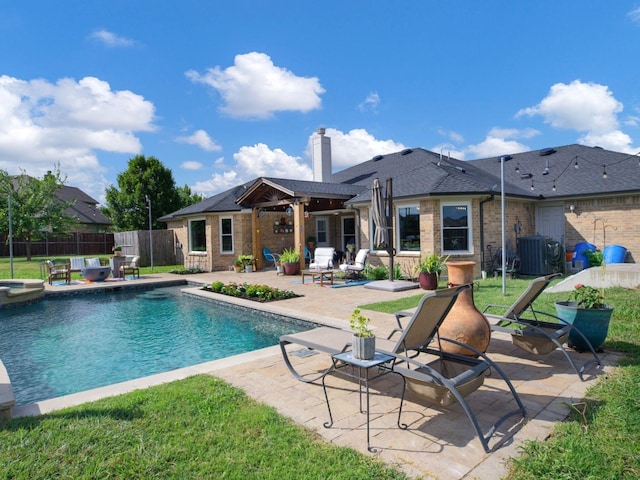 view of pool with central air condition unit and a patio