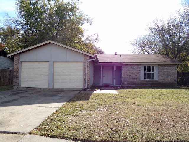 single story home with a garage and a front lawn