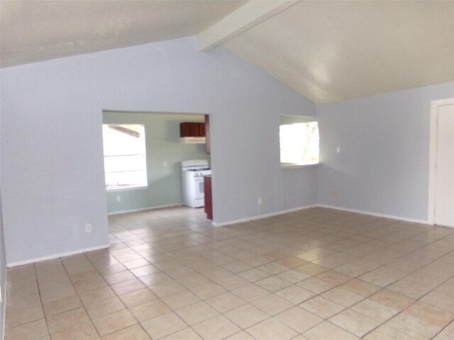 tiled spare room with lofted ceiling with beams