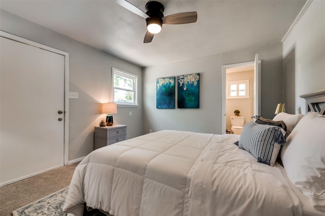 carpeted bedroom with connected bathroom and ceiling fan