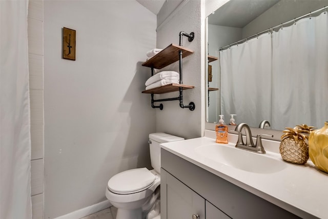 bathroom with tile patterned floors, toilet, and vanity