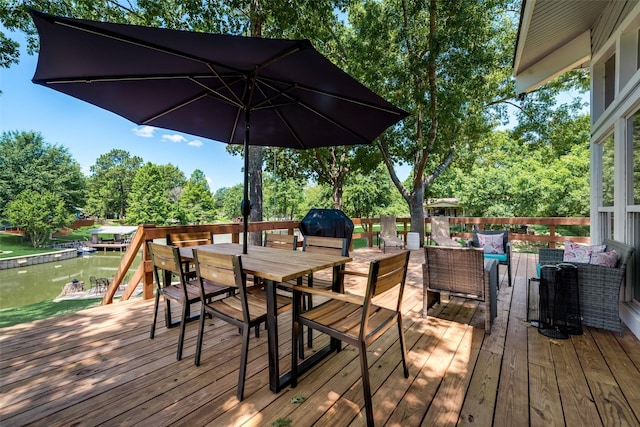 wooden terrace featuring an outdoor living space, a water view, and area for grilling