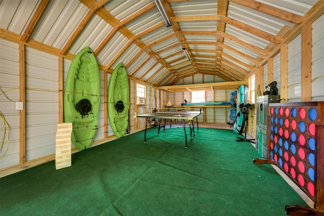 recreation room featuring vaulted ceiling and carpet