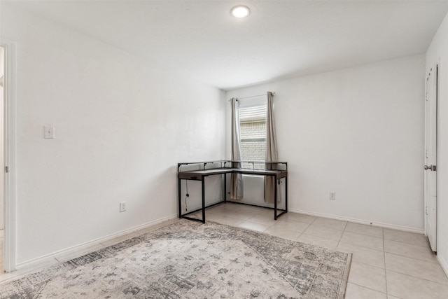 spare room with light tile patterned floors