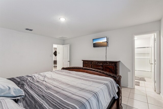 tiled bedroom with ensuite bathroom