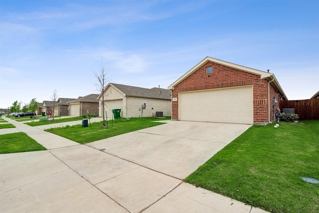 view of front facade with a front yard and a garage