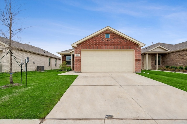 view of front facade featuring a front yard, central AC, and a garage