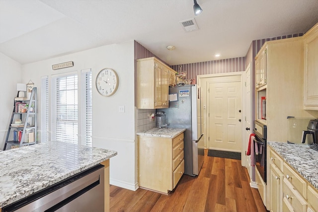 kitchen with stainless steel fridge, wine cooler, tasteful backsplash, dark hardwood / wood-style floors, and oven