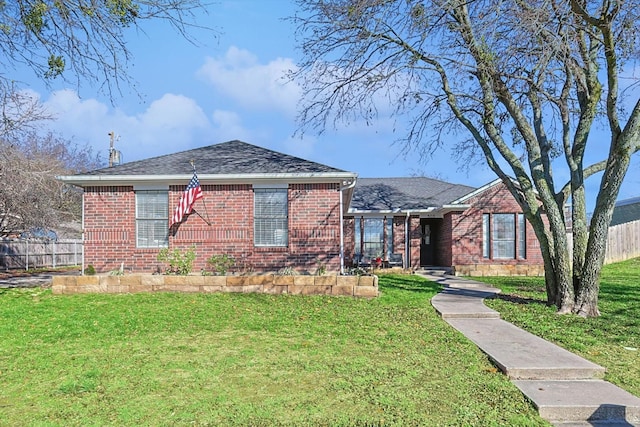 bungalow-style home with a front lawn