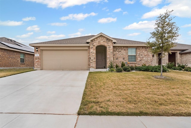 ranch-style home featuring a garage and a front yard