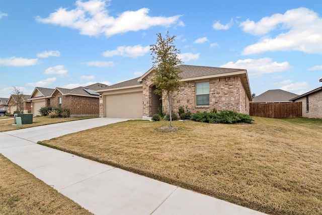 ranch-style house with a garage and a front yard