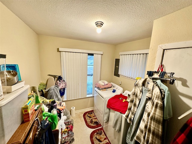 bedroom with independent washer and dryer and a textured ceiling