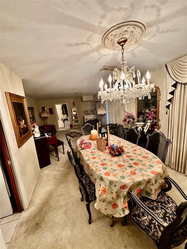 carpeted dining room featuring a textured ceiling and a notable chandelier