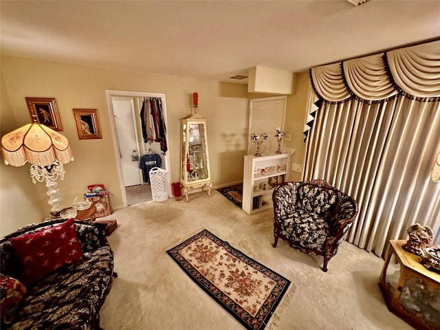 sitting room featuring carpet floors