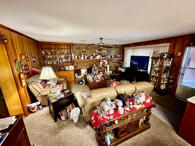 carpeted living room featuring wood walls and ceiling fan