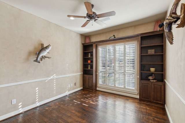 unfurnished room featuring dark hardwood / wood-style flooring and ceiling fan