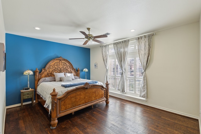 bedroom featuring dark hardwood / wood-style floors and ceiling fan