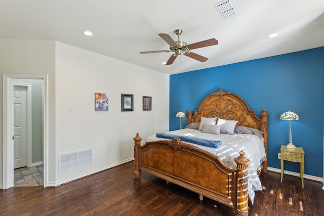 bedroom with dark hardwood / wood-style floors and ceiling fan