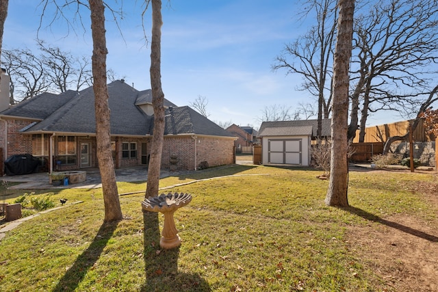 view of yard featuring a patio and a storage unit