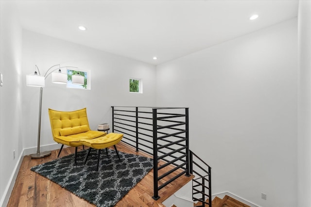 sitting room with hardwood / wood-style floors