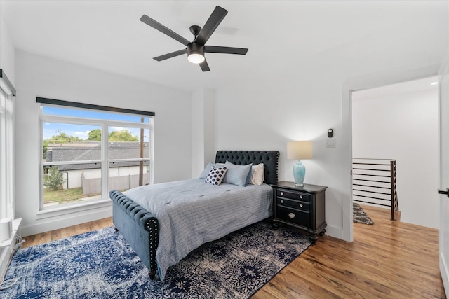 bedroom featuring hardwood / wood-style floors and ceiling fan