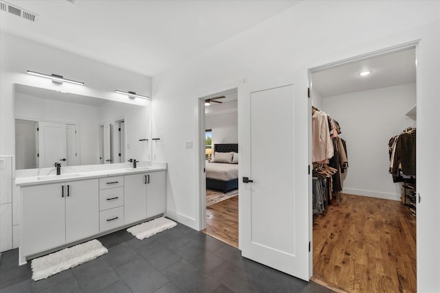 bathroom with vanity and hardwood / wood-style flooring