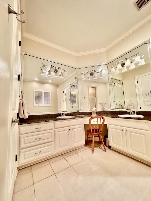 bathroom with tile patterned floors, ornamental molding, and vanity