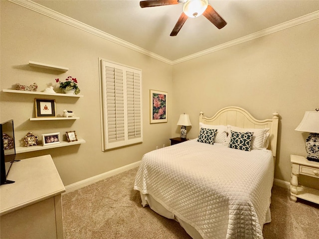 carpeted bedroom with ornamental molding and ceiling fan