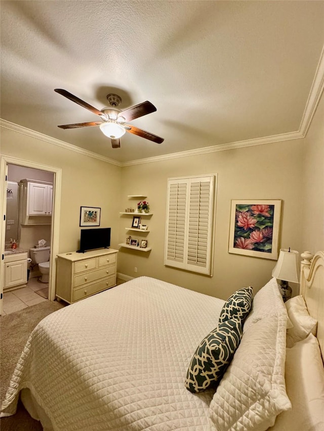 bedroom with ceiling fan, ensuite bathroom, ornamental molding, a textured ceiling, and light tile patterned flooring