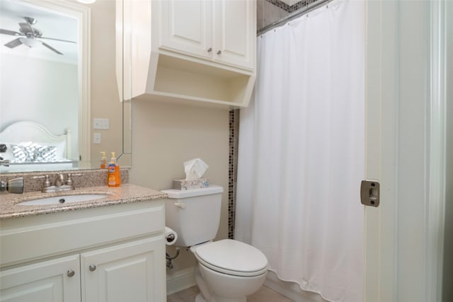 bathroom with ceiling fan, vanity, and toilet