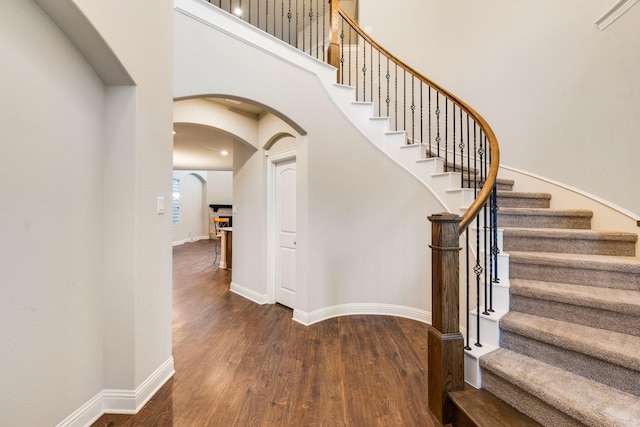 stairs featuring hardwood / wood-style flooring