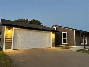 view of front of home with an outbuilding and a garage